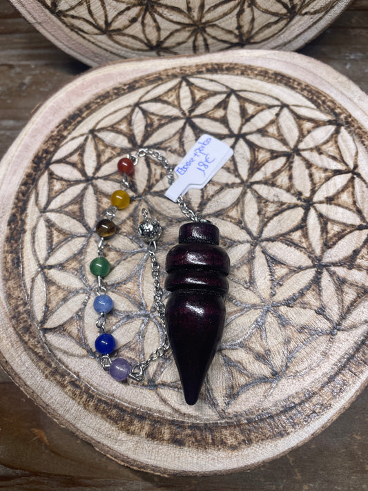 Pendule en bois d'ébène et perles
